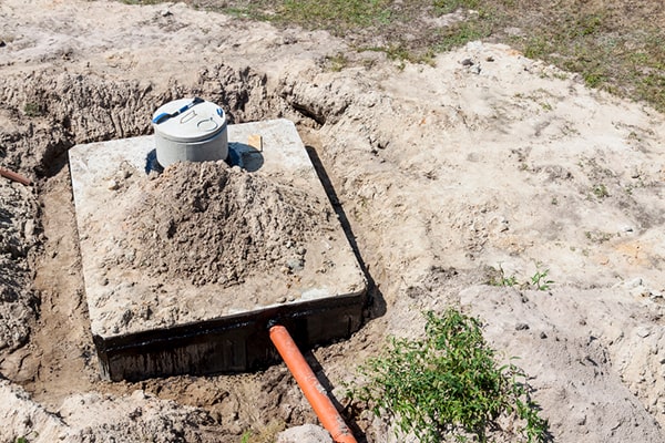during septic tank pumping, a professional will use a vacuum truck to remove the solids and liquids from the tank